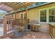 Outdoor deck with a grill, seating, and a wood railing overlooking the backyard at 120 Timbervalley Ln, Lawrenceville, GA 30043