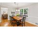 Dining room featuring a table and chairs with wood floors and natural light at 120 Timbervalley Ln, Lawrenceville, GA 30043