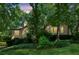 Exterior view of home surrounded by mature trees and shrubs in a landscaped yard at 120 Timbervalley Ln, Lawrenceville, GA 30043