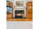 Elegant fireplace with marble surround and decorative mantel flanked by built-in cabinets at 120 Timbervalley Ln, Lawrenceville, GA 30043