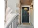 Close-up of front door with decorative window and welcoming 'hello' mat at 120 Timbervalley Ln, Lawrenceville, GA 30043