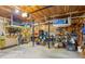 Well-lit garage with ample storage racks, work area, and concrete flooring at 120 Timbervalley Ln, Lawrenceville, GA 30043