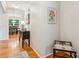 Hallway featuring hardwood floors and views of the dining room beyond at 120 Timbervalley Ln, Lawrenceville, GA 30043