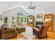 Open living space with a fireplace, large windows, and comfortable seating at 120 Timbervalley Ln, Lawrenceville, GA 30043