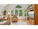Sunlit living room with large windows and hardwood flooring at 120 Timbervalley Ln, Lawrenceville, GA 30043