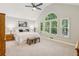 Spacious primary bedroom with vaulted ceiling, large windows, and plush carpeting at 120 Timbervalley Ln, Lawrenceville, GA 30043