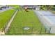 Community playground, fenced, with a nearby tennis court and picnic area at 120 Timbervalley Ln, Lawrenceville, GA 30043