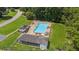 Aerial view of a community pool area with lounge chairs and a clubhouse at 120 Timbervalley Ln, Lawrenceville, GA 30043