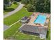 Aerial view of the community pool with lounge chairs and shaded pavilion at 120 Timbervalley Ln, Lawrenceville, GA 30043