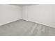 Unfinished basement with neutral carpeting and walls perfect for customization at 2438 Suwanee Pointe Dr, Lawrenceville, GA 30043