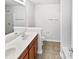 Well-lit bathroom featuring a double sink vanity, tile flooring, and modern fixtures at 2438 Suwanee Pointe Dr, Lawrenceville, GA 30043