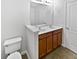 Bathroom with a double vanity, wooden cabinetry, and ample counter space, offering convenience and style at 2438 Suwanee Pointe Dr, Lawrenceville, GA 30043