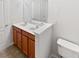 Bathroom with a double sink vanity, modern fixtures, and a neutral color scheme at 2438 Suwanee Pointe Dr, Lawrenceville, GA 30043