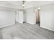 A spacious, carpeted bedroom with multiple entrances and neutral paint, providing versatile living space at 2438 Suwanee Pointe Dr, Lawrenceville, GA 30043