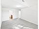 Large bedroom with neutral carpet and white walls, offering a bright and versatile living space at 2438 Suwanee Pointe Dr, Lawrenceville, GA 30043