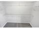 Walk-in closet equipped with adjustable shelving for optimal storage and organization at 2438 Suwanee Pointe Dr, Lawrenceville, GA 30043