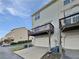 Townhome features attached garage and private balcony, offering convenient parking and outdoor living space at 2438 Suwanee Pointe Dr, Lawrenceville, GA 30043