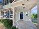 Inviting covered front door with stone accents and a view of the landscape at 2438 Suwanee Pointe Dr, Lawrenceville, GA 30043