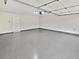 Clean, well-lit garage featuring a sealed floor and plenty of open space for vehicles and storage at 2438 Suwanee Pointe Dr, Lawrenceville, GA 30043