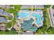 Aerial view of community pool with unique water features, lounging areas, and clubhouse at 3278 Shakerley Park, Douglasville, GA 30135