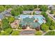 Community pool and clubhouse aerial view, surrounded by trees and parking area at 3278 Shakerley Park, Douglasville, GA 30135