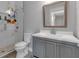 Bathroom featuring a gray vanity and tiled shower with a large mirror at 3278 Shakerley Park, Douglasville, GA 30135
