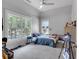 Cozy bedroom with a large window view and a ceiling fan at 3278 Shakerley Park, Douglasville, GA 30135