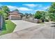 Driveway leading to a house with a garage and trees in the background at 3278 Shakerley Park, Douglasville, GA 30135