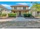 Charming two-story home features a welcoming front porch and well-maintained landscaping at 3278 Shakerley Park, Douglasville, GA 30135