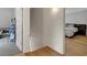 Hallway leading to a bedroom with hardwood floors and white shiplap walls at 3278 Shakerley Park, Douglasville, GA 30135