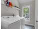Laundry room featuring a washer and dryer with a window view at 3278 Shakerley Park, Douglasville, GA 30135