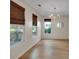 Living room with shiplap walls, hardwood floors, woven blinds, and large windows for natural light at 3278 Shakerley Park, Douglasville, GA 30135