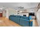 Well-lit living area features a fireplace, hardwood floors, and a comfortable blue sectional sofa at 3278 Shakerley Park, Douglasville, GA 30135