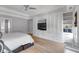 Main bedroom features custom built-ins, tray ceiling, and plenty of natural light at 3278 Shakerley Park, Douglasville, GA 30135