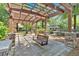 Covered outdoor seating area with stone columns, benches and shade structure in a community park at 3278 Shakerley Park, Douglasville, GA 30135