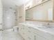 Elegant bathroom with marble floors, double vanity, and a walk-in shower with glass enclosure at 3445 Stratford Ne Rd # 3403, Atlanta, GA 30326