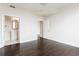 Bedroom featuring hardwood floors, neutral walls, and doorways leading to an ensuite bathroom at 3445 Stratford Ne Rd # 3403, Atlanta, GA 30326