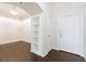 Elegant entryway features hardwood floors, built-in shelving, and a modern chandelier at 3445 Stratford Ne Rd # 3403, Atlanta, GA 30326