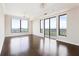Bright living room with hardwood floors, chandelier, and panoramic city views at 3445 Stratford Ne Rd # 3403, Atlanta, GA 30326