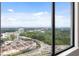 Stunning city view from a large window showcases lush greenery and urban landscape at 3445 Stratford Ne Rd # 3403, Atlanta, GA 30326