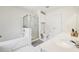 Bright bathroom featuring tub and separate shower, dual sinks, and white tile for a clean design at 350 Eagle Tiff Dr, Sugar Hill, GA 30518