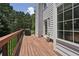 Outdoor deck perfect for grilling and enjoying nature views with a nice wood railing at 350 Eagle Tiff Dr, Sugar Hill, GA 30518