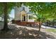 Charming home exterior with a brick foundation, bay window, and manicured landscaping at 350 Eagle Tiff Dr, Sugar Hill, GA 30518