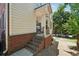 View of a home entrance and a well-kept yard. There is a small set of stairs at 350 Eagle Tiff Dr, Sugar Hill, GA 30518