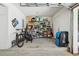 Well-organized garage with storage shelves and space for bikes and equipment at 350 Eagle Tiff Dr, Sugar Hill, GA 30518