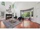 Spacious living room features a cozy fireplace, large windows, and hardwood floors for comfortable living at 350 Eagle Tiff Dr, Sugar Hill, GA 30518