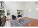 Bright living room with hardwood floors, a fireplace, and large bay window provides natural light at 350 Eagle Tiff Dr, Sugar Hill, GA 30518