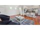 An open floor plan showcases a well-lit living room and stylish kitchen with bar seating at 350 Eagle Tiff Dr, Sugar Hill, GA 30518