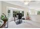 Bright home office area with a large bay window providing natural light, creating an inviting workspace at 350 Eagle Tiff Dr, Sugar Hill, GA 30518