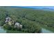 Charming waterfront home nestled among lush trees, providing stunning views of the tranquil lake and surrounding landscape at 7560 Island Mill Rd, Acworth, GA 30102